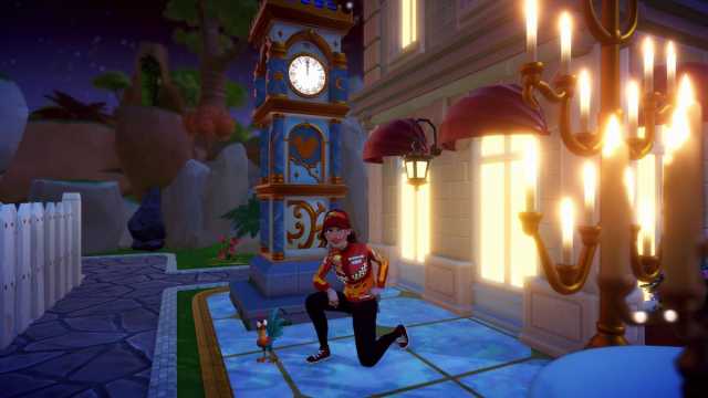 The player posing by the Elegant Town Square Clock in Disney Dreamlight Valley.