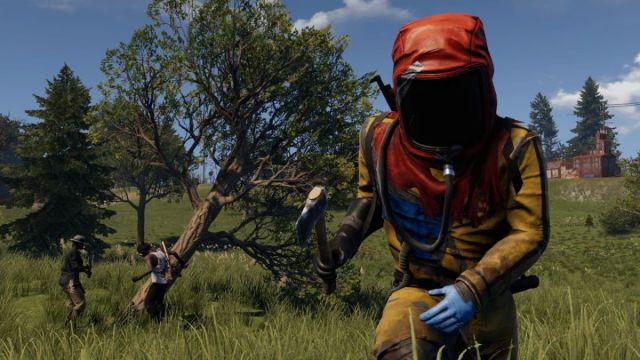Rust player wearing a hazmat suit and charging forward with  an Axe in right hand
