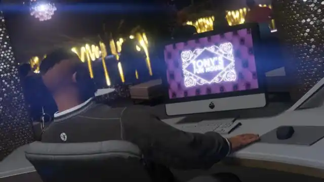 An image from GTA online of the player character at the nightclub computer.