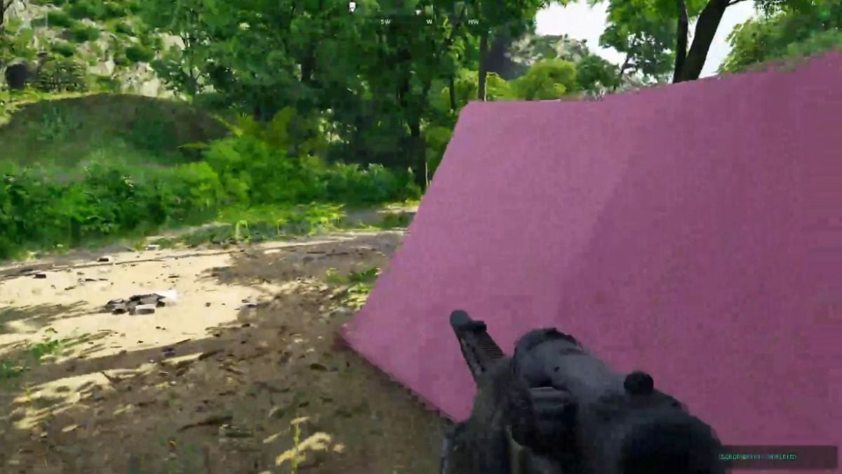 Player holding a rifle next to the pink tent