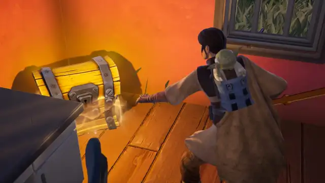 Leia opening a container in Fortnite.