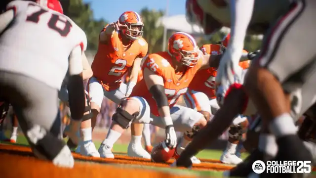A Clemson quarterback calls a play at the line in EA College Football 25.
