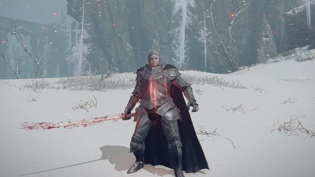 The Tarnished holds a bloody blade after using the Seppuku ability in Elden Ring.