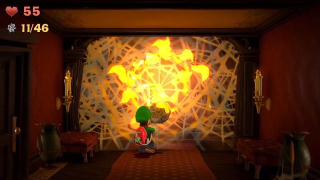 Luigi killing a spider web with fire