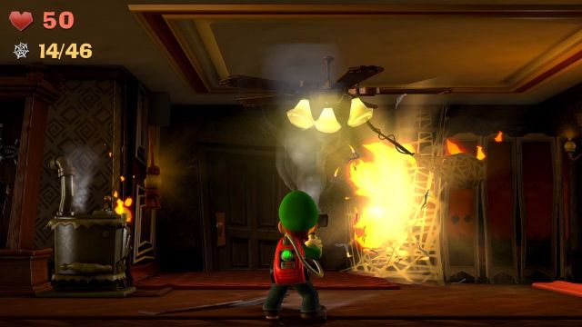 Luigi burning a spider web