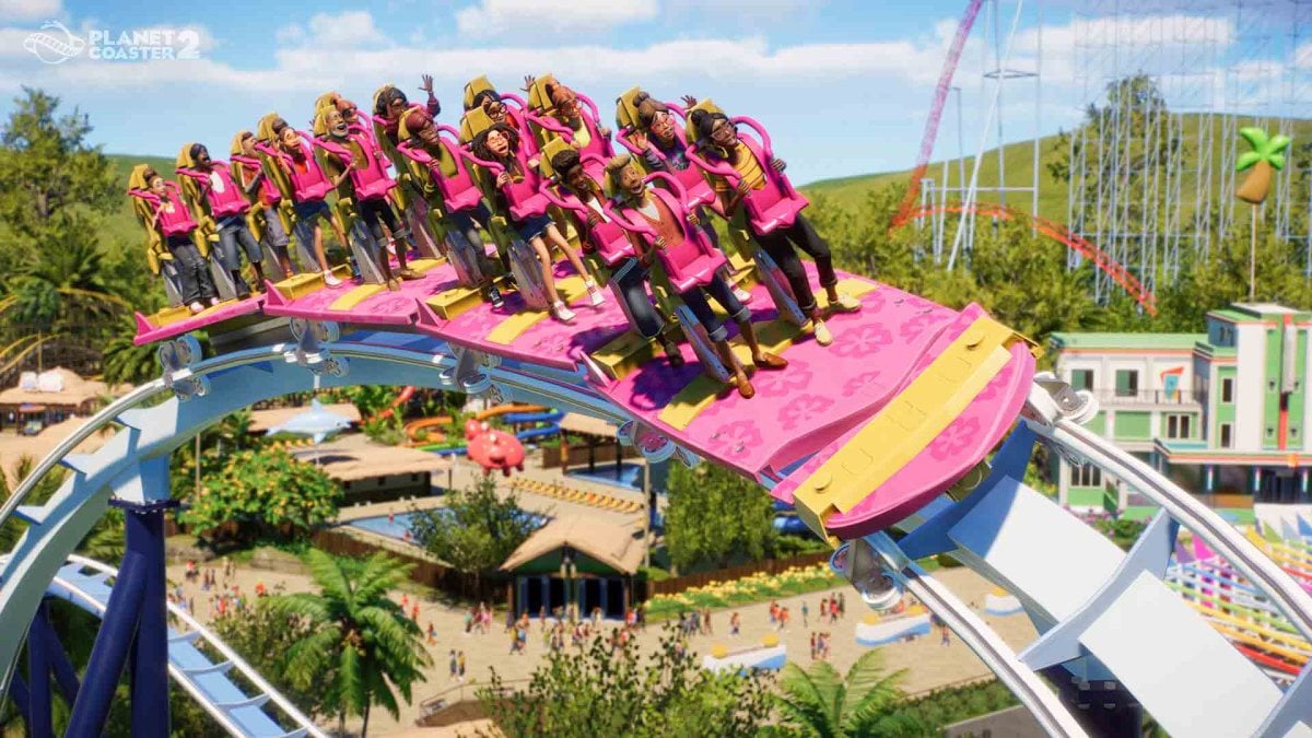 Planet Coaster 2 key art showing people riding a pink rollercoaster in a theme park