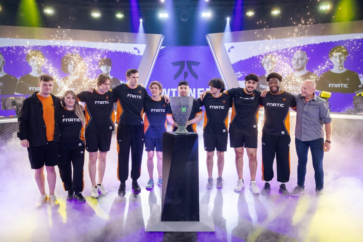 The Fnatic VALORANT team stand behind the VCT EMEA trophy.