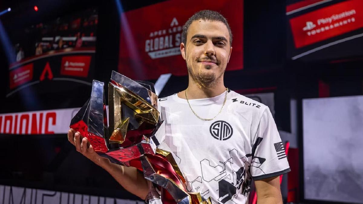 ImperialHal holds the Apex Legends Championship trophy after winning with TSM