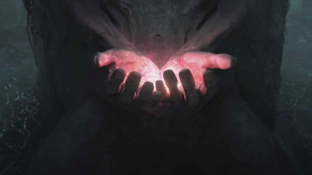 Once Human cutscene with two hands holding a small light.