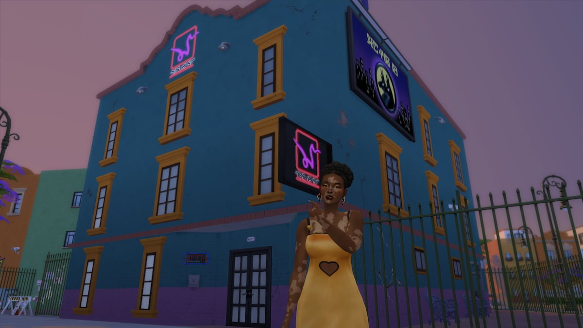 A Sim pointing at the Beso Rapido Motel in The Sims 4 Lovestruck.