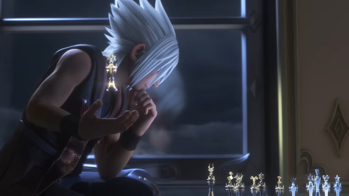 Riku throwing a chess piece in his right hand while looking at the chess board with his head resting in his left hand