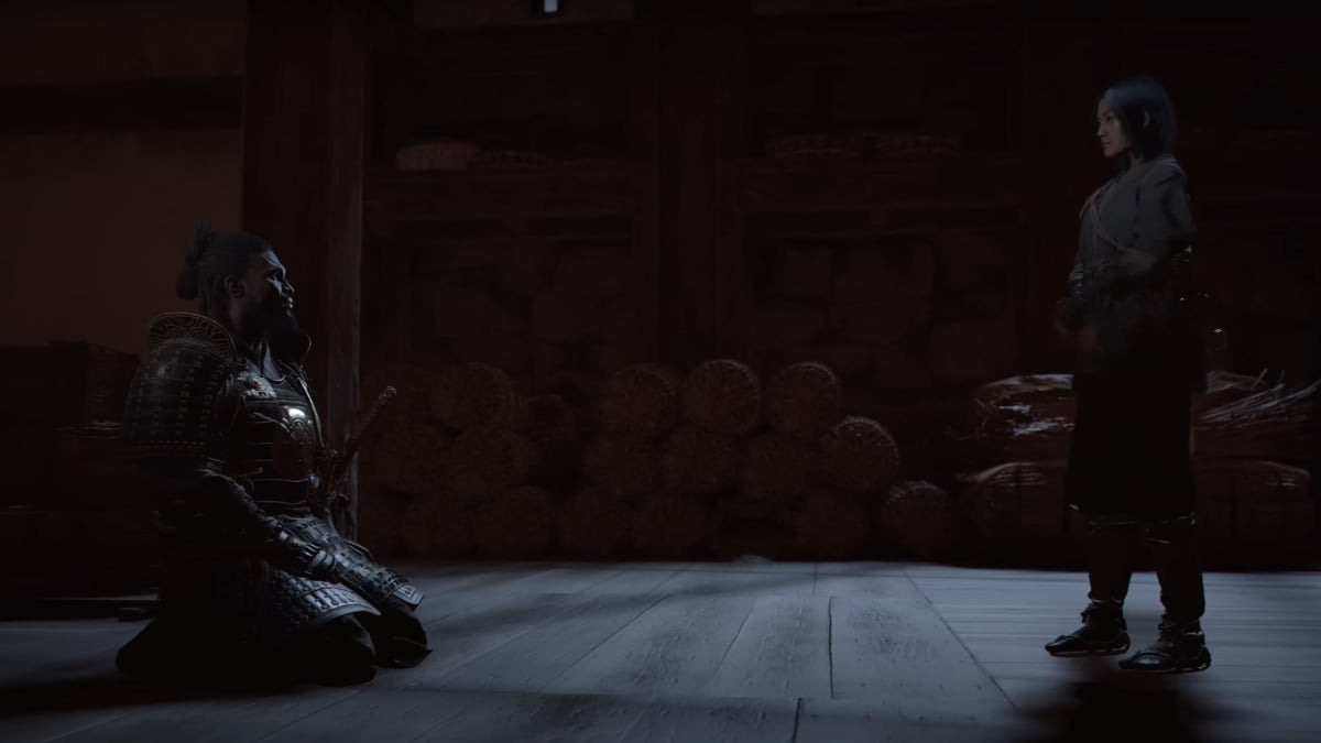 An image from Asssassin's Creed shadows of the two protagonists. Naoe is standing up, looking at Yasuke as he sits down in full armor.