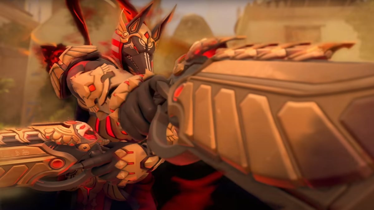 An image of Reaper from Overwatch 2 using his ultimate while wearing his new Mythic Skin. This skin turns him into Anubis, and gives sand-themed effects to his attacks.