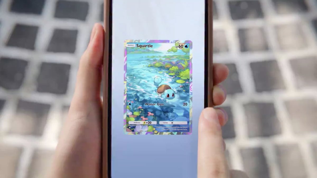 Someone holding a phone with a Squirtle card in TCG Pocket.