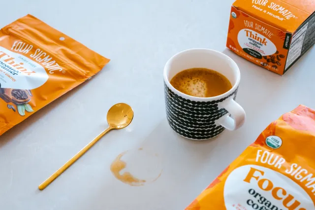 Four Sigmatic's Think and Focus coffee with stirring spoon