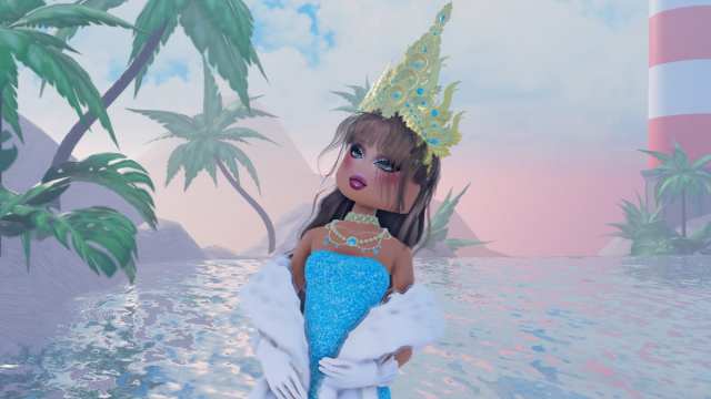 A character wearing a crown standing on a beach in Roblox Dress To Impress.