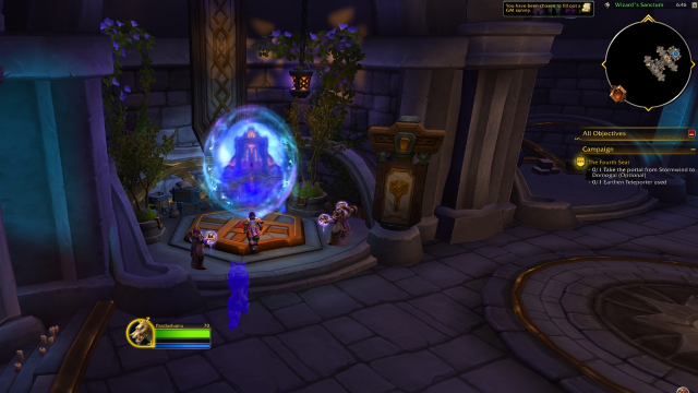 A player standing in front of a portal leading to Dornogal from the Alliance city Stormwind