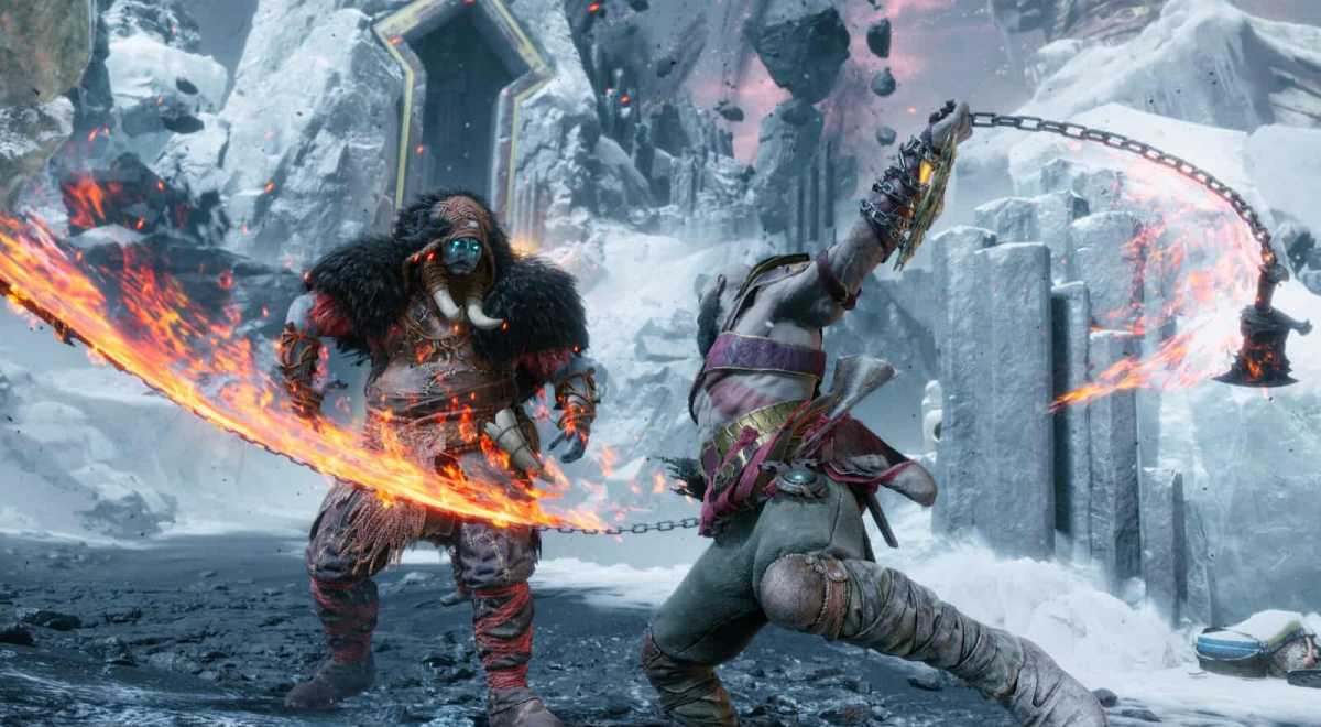 God of War's Kratos attacks a hooded enemy with a flaming flail