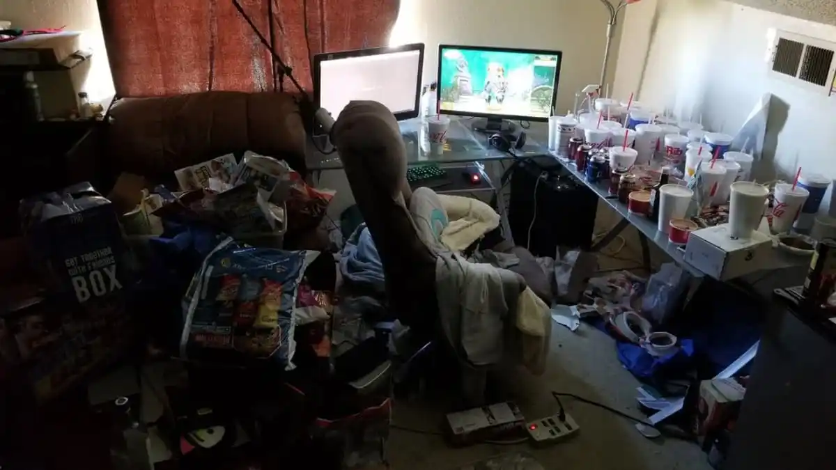 An image of the Twitch streamer Asmongold's room, which is filled with trash.