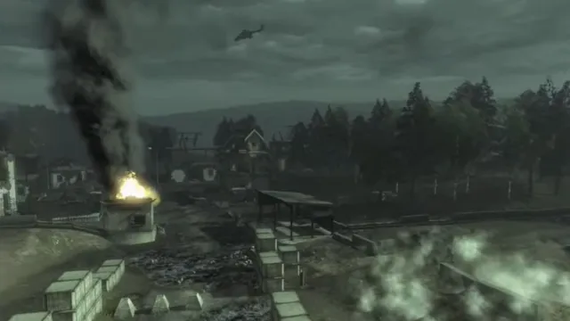 A wide shot of ongoing war with a helicopter flying overhead as explosions hit the ground