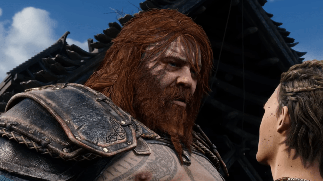 An unkempt red-haired man in leather armor stares down at a young man slightly out of frame. Image of Thor from God of War Ragnarok