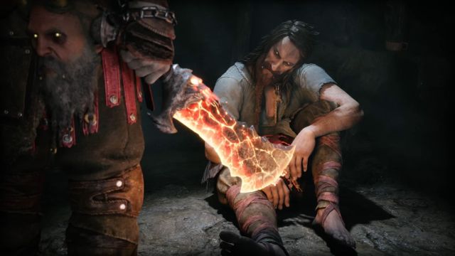 A tall man with glowing eyes and tattered clothing stares at a glowing red blade in the foreground. Image of Tyr and Kratos from God of War Ragnarok