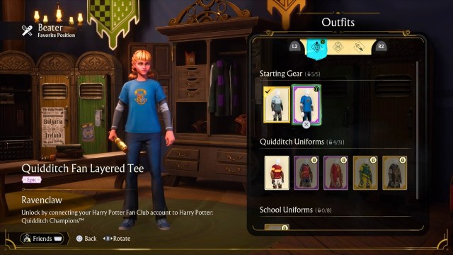 A player holding a bat wearing a layered house tee in quidditch champions