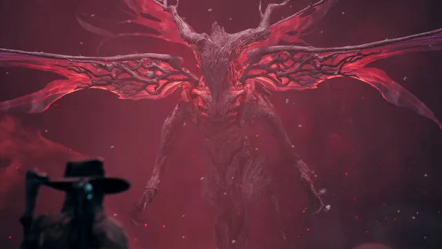 Remnant 2 character in a cowboy hat facing Annihilation, a red tree demon