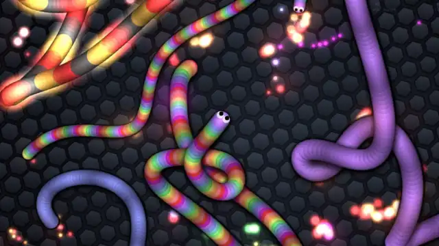 Slither.io game screen showing three multi-colored snakes eating energy balls