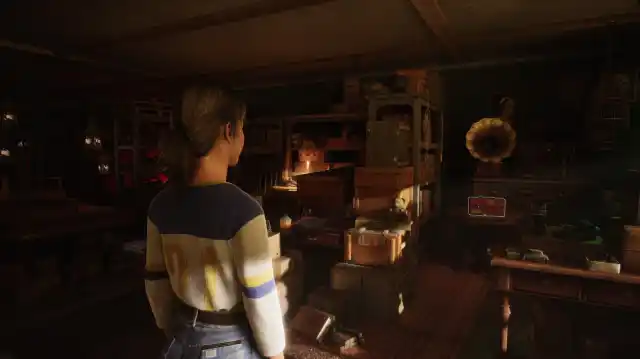 A woman stands in an old-fashioned room of antiques, a box is highlighted in white