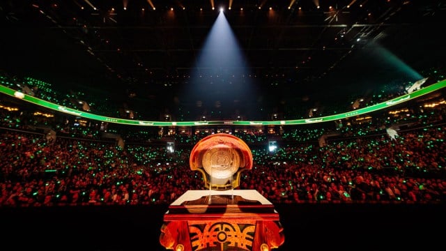 The Aegis of Champions sits on a plinth with a crowd looking at it from the stands.