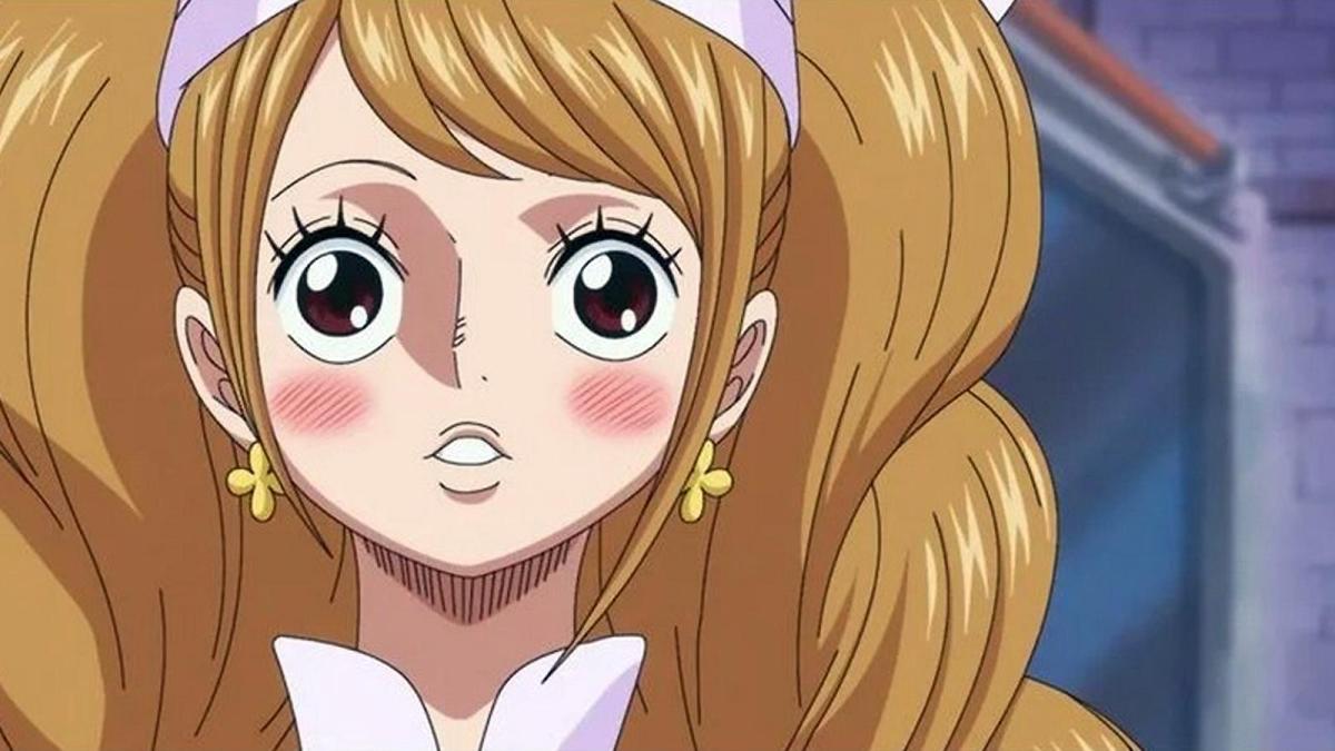 Charlotte Pudding from One Piece looks surprised with rosey cheeks and wide eyes.