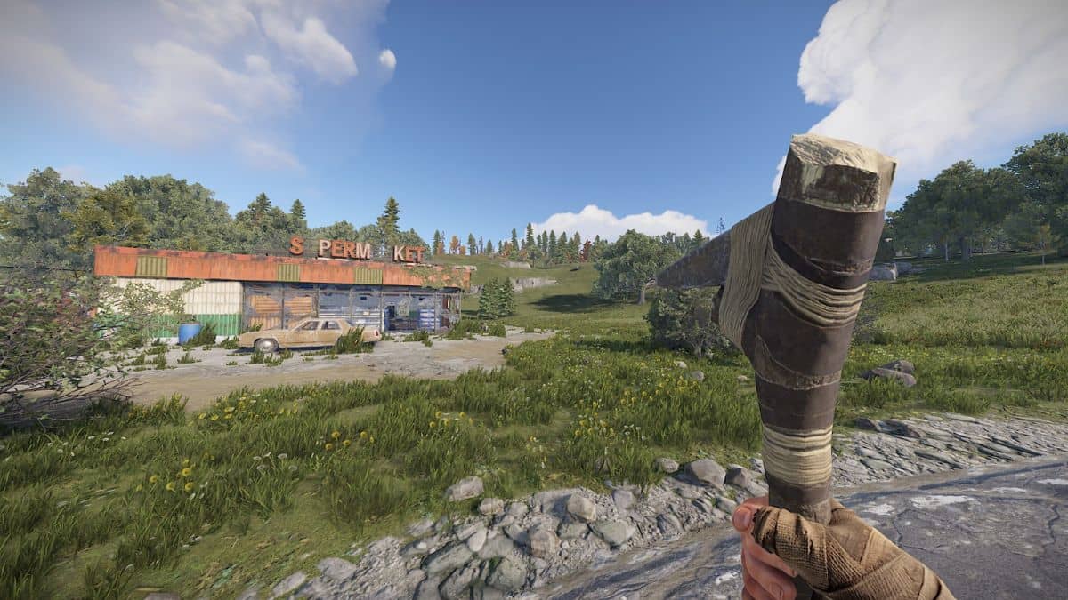 A player with a Stone Pick Axe standing near the Abandoned Supermarket monument.