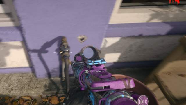 A player stood in front of a faucet on a lilac wall in Black Ops 6 Zombies.