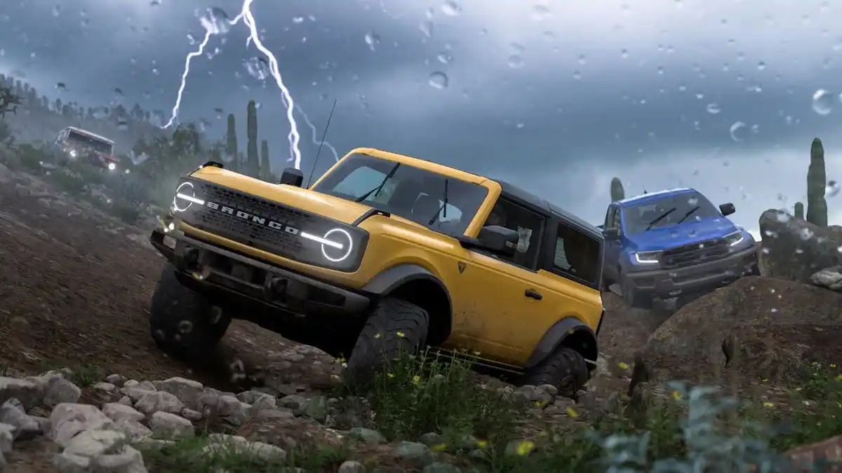 Three cars racing through a muddy path with rain and lightning in the background