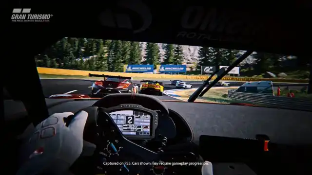 A driver chasing multiple other cars on a track in Gran Turismo 7.