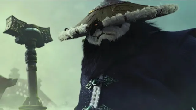 A pandaren male holding a staff in WoW Mists of pandaria.