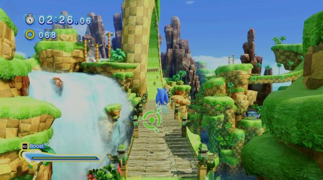 sonic is in the air looking at a wooden bridge with a spiral track behind it