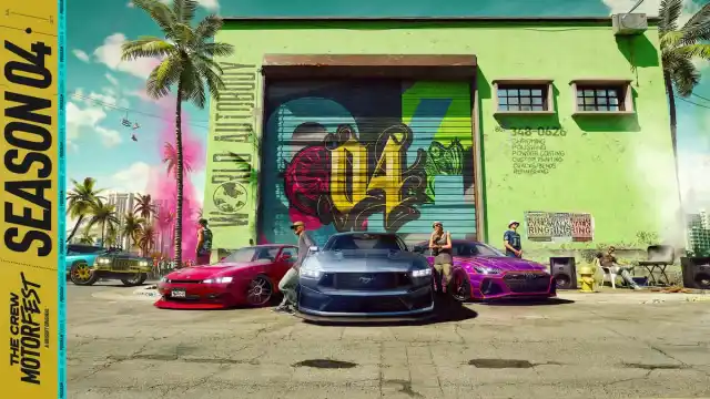 The different cars and their drivers standing in front of a green garage.