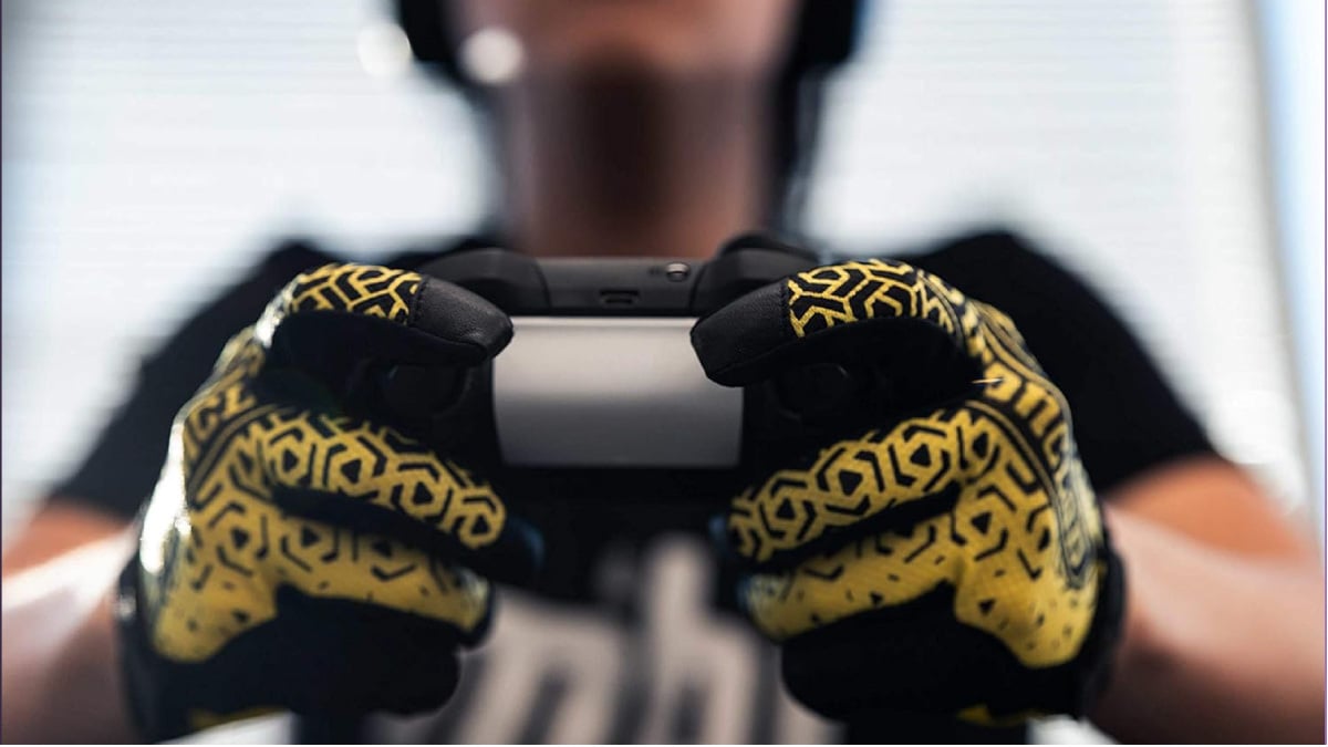 Gamer playing a console game with the Ironclad Console Gloves.