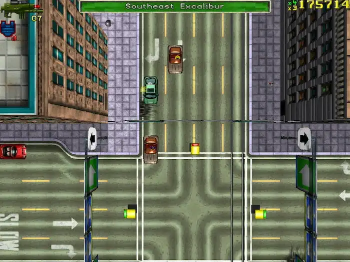 GTA1 screenshot, featuring a top-down view of a city street with cars traveling through an intersection.