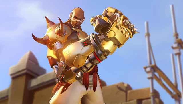 Doomfist holds his massive golden gauntlet in a celebratory pose in OW2