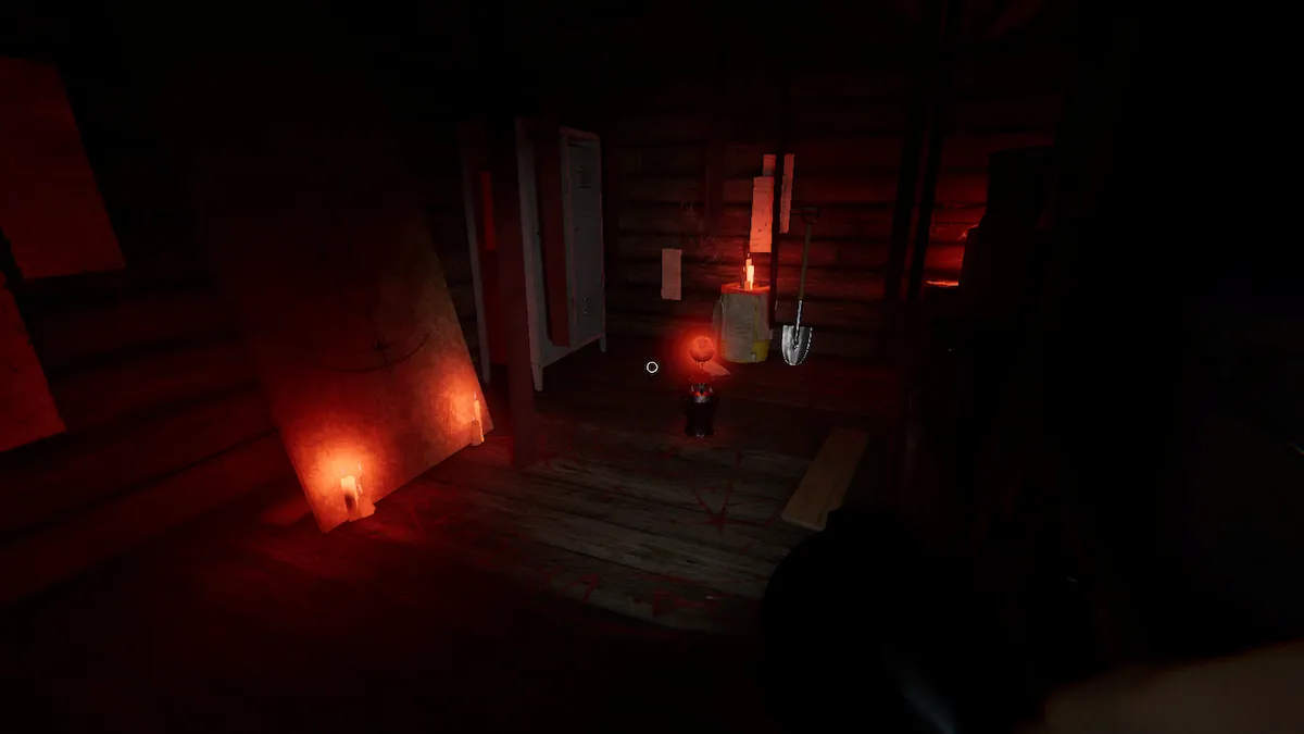 A Totem on the ground in a circle in a storage room on the second floor of Grafton Farmhouse in Phasmophobia. 