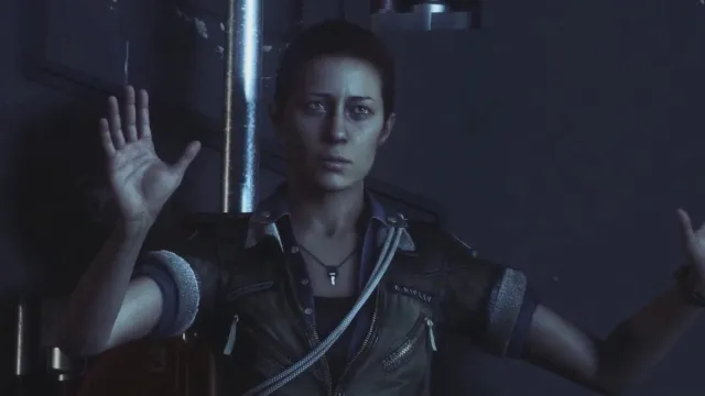 Amanda Ripley holding her hands up while being questioned by Axel (off screen)