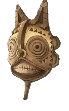 A yellow tribal mask with teeth and spiral eyes. This shows readers what the Curious Mask looks like