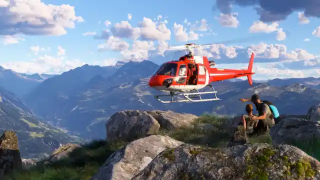 A red helicopter over a mountain in Microsoft Flight Simulator 2024.