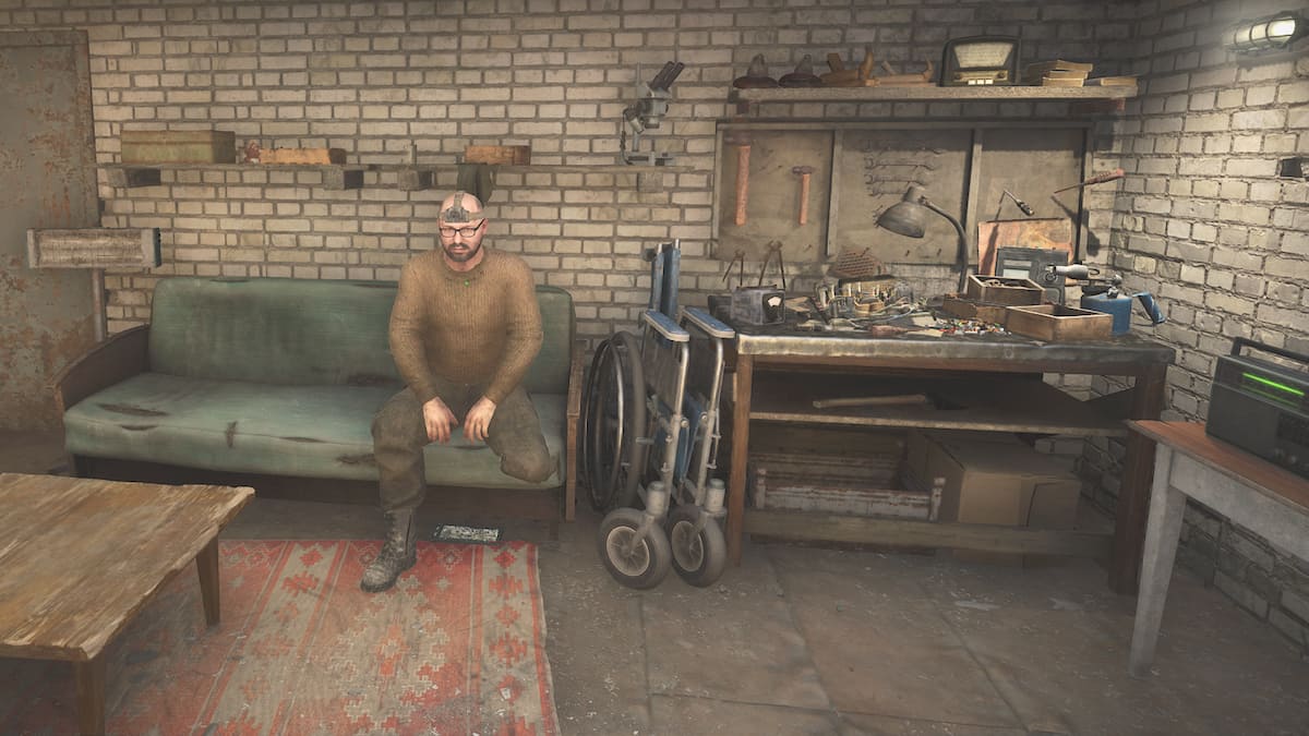 Lens sitting on a couch in his workshop