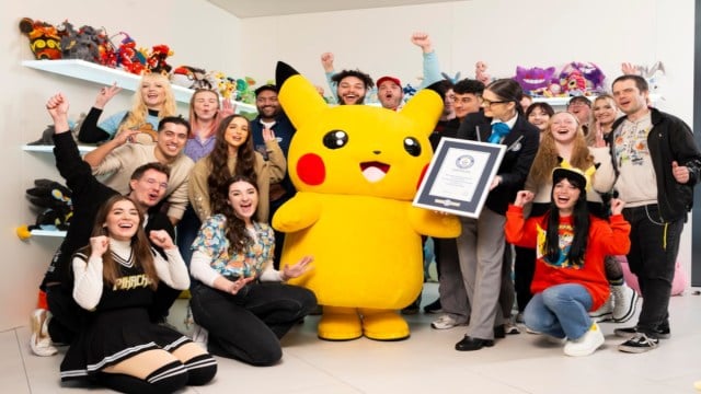 A group of Pokemon Content Creators with Pikachu collecting a Guiness World Record certificate.