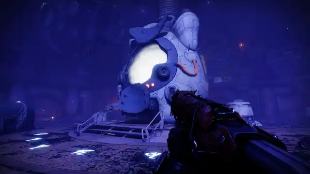 A guardian holds Scavenger's Fate in their hands inside the Prison of Elders.