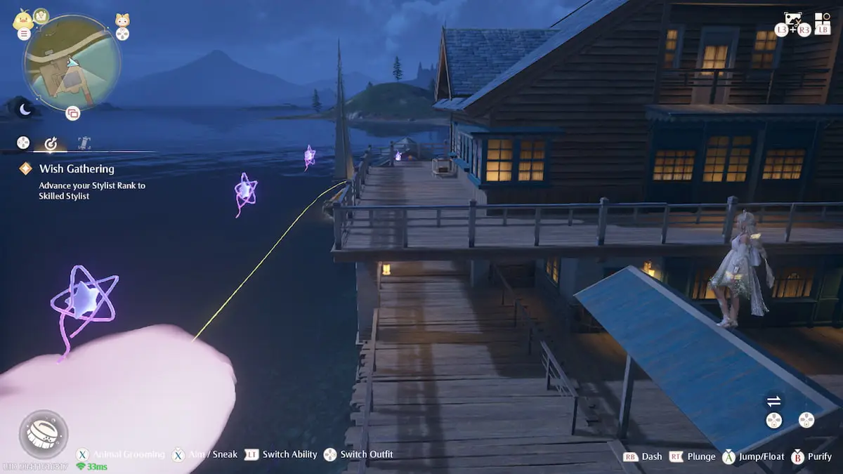 Nikki stands near a pink cloud and Whimstar pieces at the docks